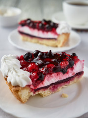 Cake dessert with cream, currants, cherries and coffee