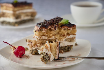 Dwlicious cake dessert with cream, cherries and coffee