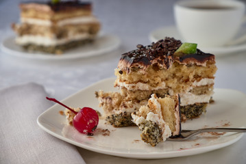 Delicious cake dessert with cream, cherries and coffee