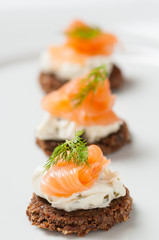 salmon with cream cheese on a slice of rye bread