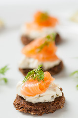salmon with cream cheese on a slice of rye bread
