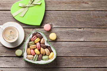 Macaroons in Valentines day gift box and coffee