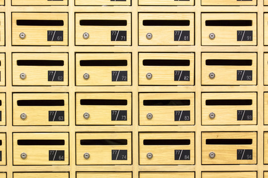 Front View Of Yellow Wooden Postboxes Apartment. Locker Wooden Mail Boxes Postal