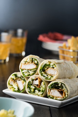 Breaded Chicken burrito Wrap With Fresh Lettuce Cheese on rustic