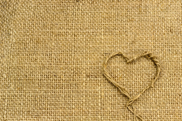 background of burlap with handmade heart