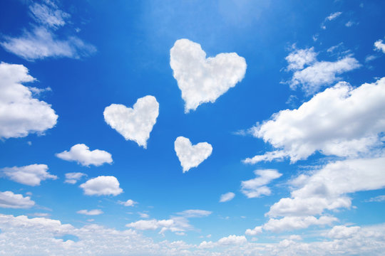 Three White Heart Shaped Clouds On Blue Sky Stock Photo | Adobe Stock