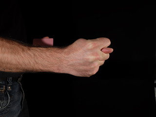 Obraz na płótnie Canvas Man showing fingers from a Fig