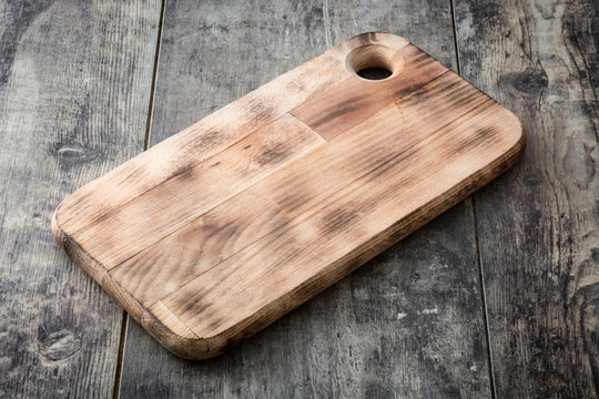 Cutting board on wooden background
