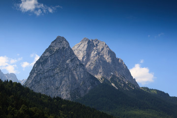 Typical landscape in southern Germany, with towering peaks and verdant valleys.