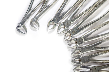 Dental Instruments arranged on white table.
