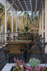 Street cafe with wicker furniture