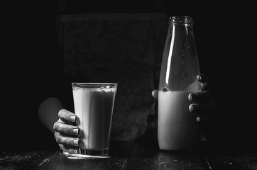 woman farmer with a glass of milk. concept problems in the agric