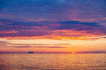 Amazing gold orange sky and water of Baltic sea at sunset