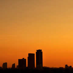 Fototapeta na wymiar Cityscape building silhouette in twilight time.