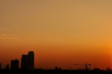 Fototapeta na wymiar Cityscape building silhouette in twilight time.