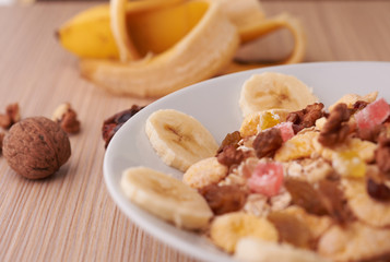 flakes with dried fruit, granola on the plate