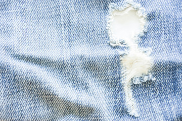 Crack hole in jeans material