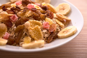 flakes with dried fruit, granola on the plate