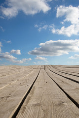 Background of landscape with blue sky and wood table