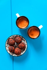  two cups of of espresso coffee and chocolate truffles on a Deep