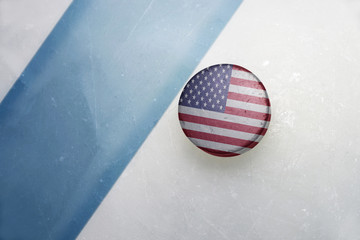 old hockey puck with the national flag of united states of america.