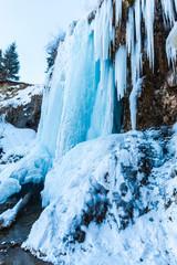 Frozen waterfall in carpathian mountains