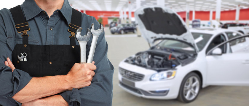 Hands of car mechanic with wrench