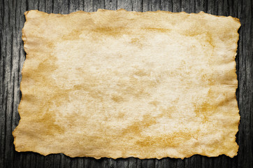 Close up of Antique old paper on wooden background