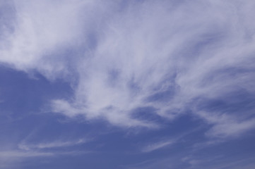 Blue sky with fluffy cloud.
