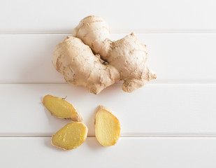 Ginger on white wooden background