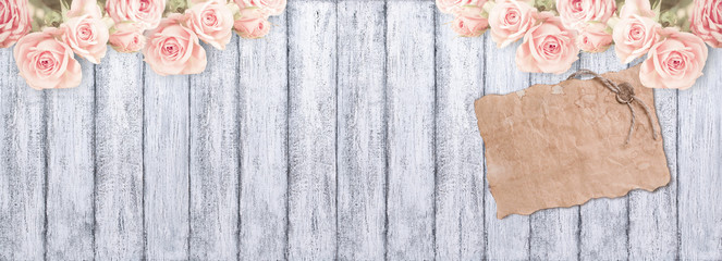 Roses and old paper with sealing wax on wooden background  