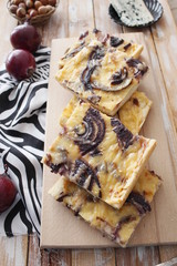 Tart flambee with purple onions, bacon and apples (Flammkuchen), selective focus