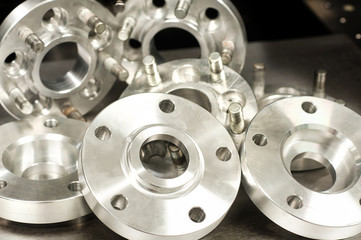Metal mold of wheel spacers and bolts. CNC industry