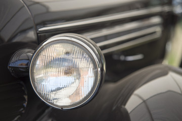 close up on old vintage car ,front light
