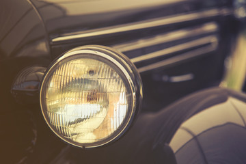 close up on old vintage car ,front light