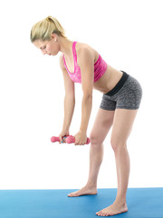 Sporty woman doing dumbbells exercise