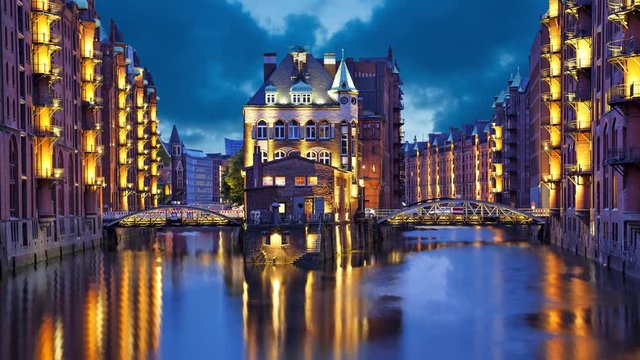 House and two brides in the evening in Speicherstadt district, Hamburg, Germany  (static image with animated sky and water)
