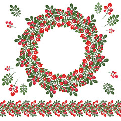 Wreath and brush of berries and leaves.