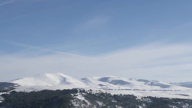 Zlatibor tourist resort with snowed hills slow tilt 4K 2160p 30fps UltraHD footage - Western Serbia mountain region by winter 3840X2160 UHD tilting video 