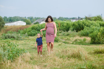 Pregnant woman with her son