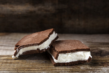 Close up of one broken cake filled with milk and yogurt cream on