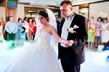 Amazing first wedding dance of wedding couple with heavy smoke a