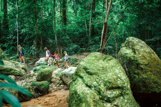 group of hikers exploring jungle in thailand