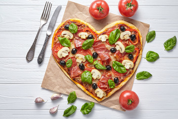 Heart pizza love concept Valentine's Day symbol romantic delicious dinner Italian homemade baked...