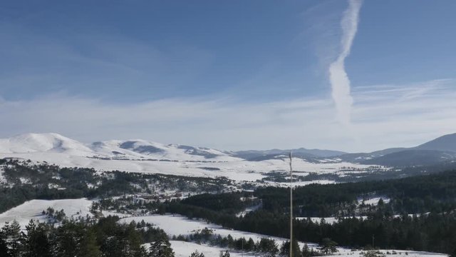 Beautiful mountain region of western Serbia by winter 4K 2160p 30fps UltraHD tilting footage - Zlatibor tourist resort with snowed hills 3840X2160 UHD video