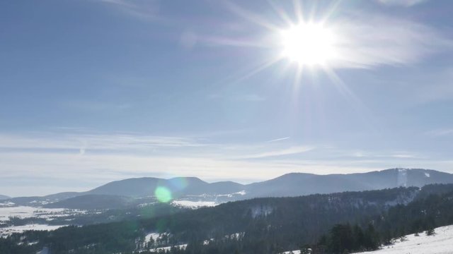 Slow tilt on Zlatibor tourist resort with snowed hills 4K 2160p 30fps UltraHD footage - Western Serbia mountain region by winter 3840X2160 UHD tilting video 