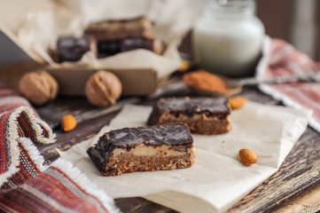 Fototapeta na wymiar Homemade healthy snack sweets - energy nut bars. Sugar-free, gluten-free, without baking. Selective focus