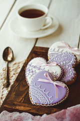 Beautiful background for Valentine's day with gingerbread hearts and cup of coffee