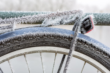 Frozen mudguard on a blue bicycle.