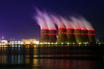 Night view of cooling towers of the Novovoronezh nuclear power plant from the cooling pond